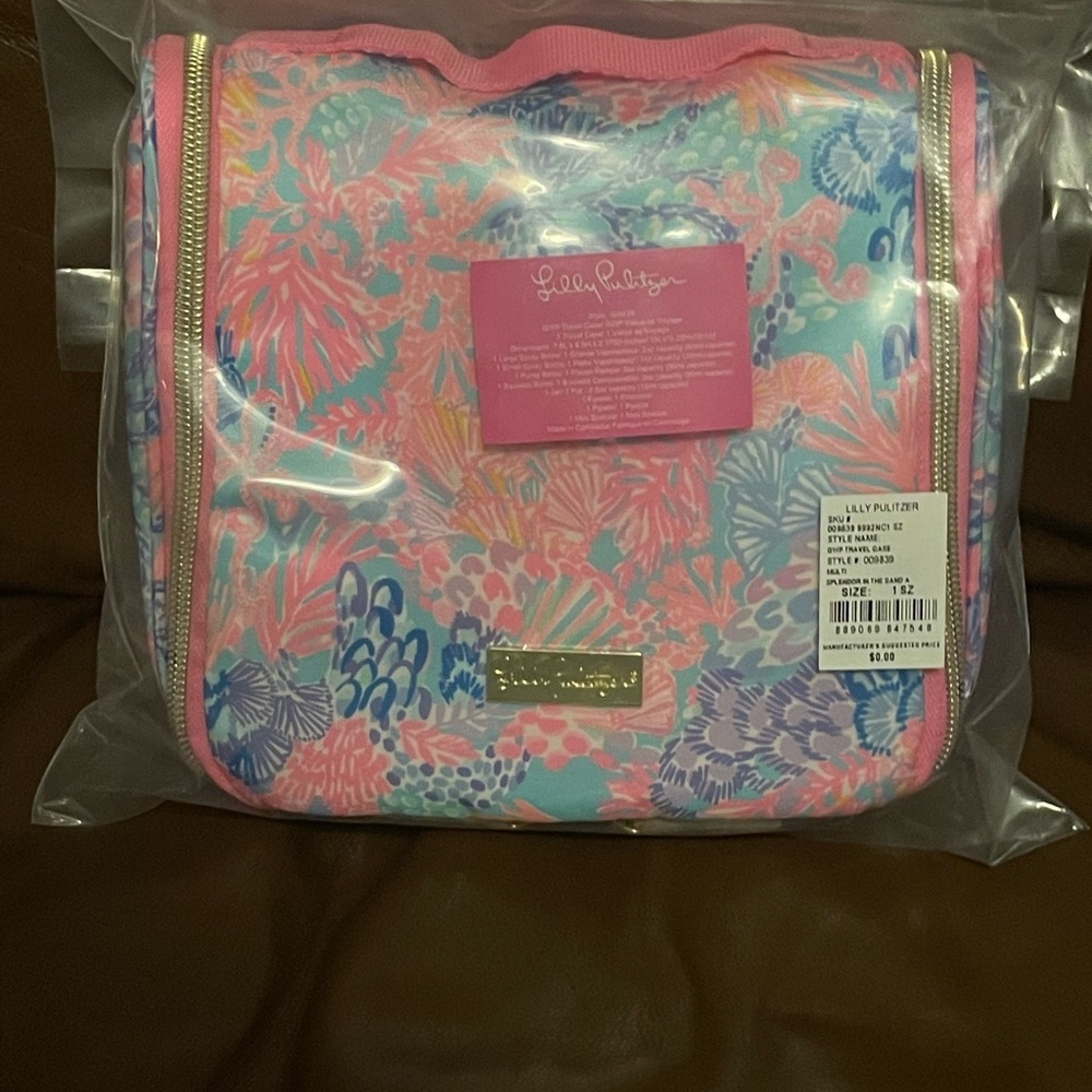 Brand new Lilly Pulitzer travel case with travel containers inside. GWP.